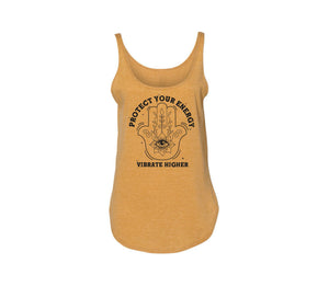 Centered front facing image of a heather gold tank top. Graphic is black. There is a Hamsa and in the center of the tank with florals going up every finger. The Hamsa is feminine and powerful. Curved around the top of the image it reads "Protect your energy" and flat under the image reads "Vibrate Higher". 